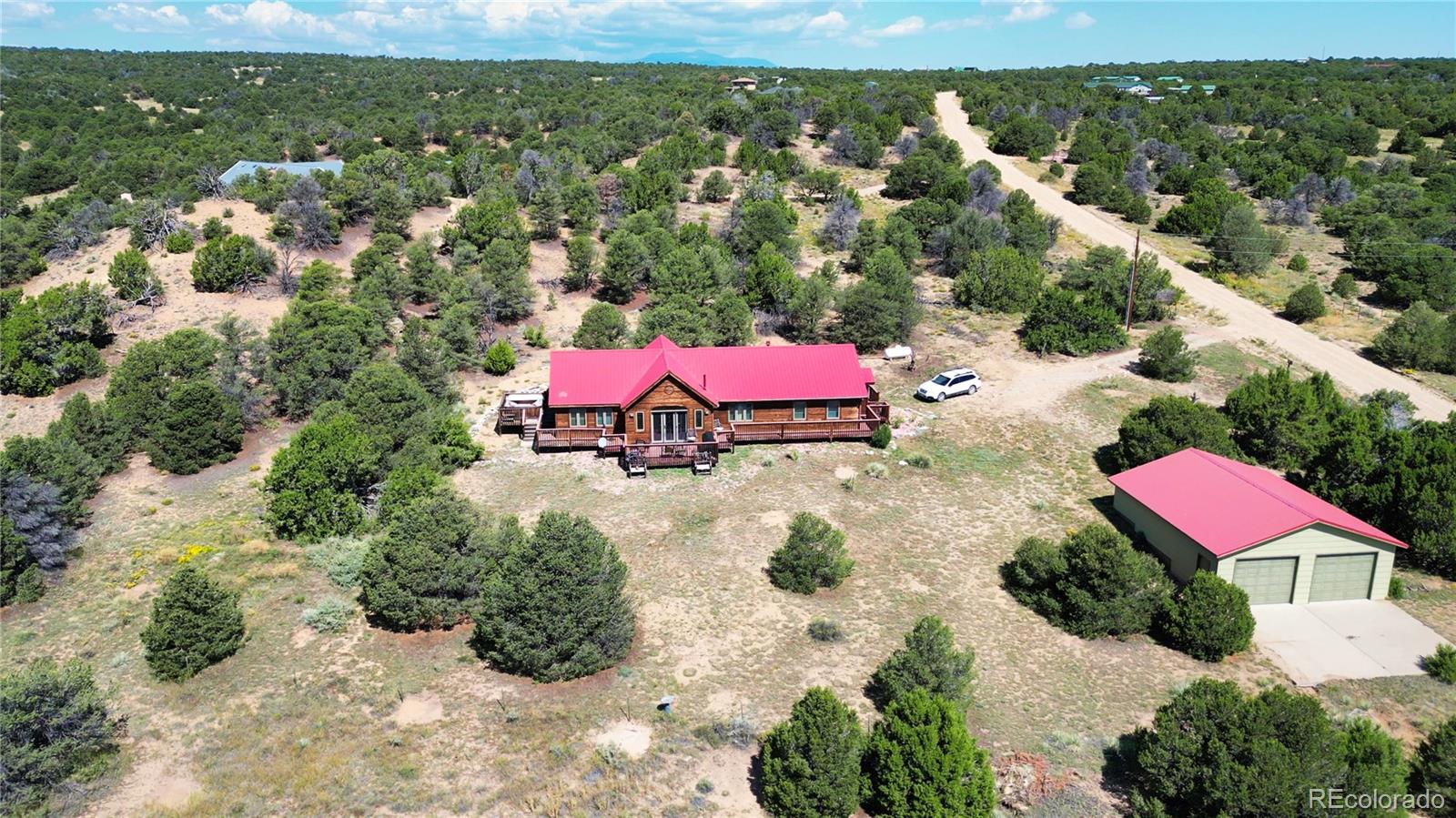 957 Vega Road Walsenburg, CO 81089 - Photo 27 of 30 a view of a city with lawn chairs under an umbrella