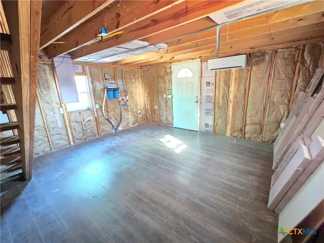a view of a hallway with stairs