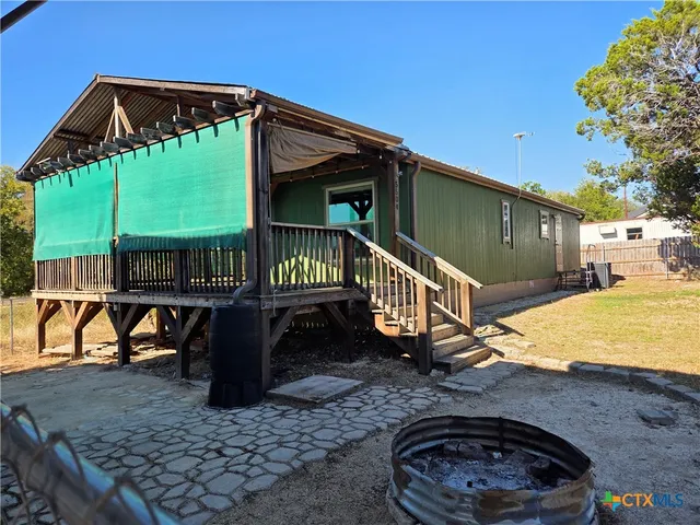 a view of a chair and table in the patio