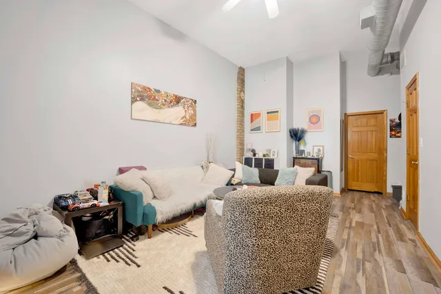 a living room with furniture and a rug