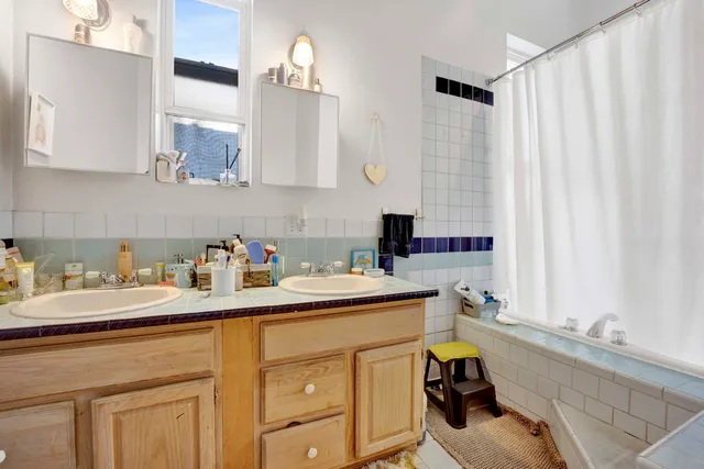 a kitchen with a sink cabinets and window