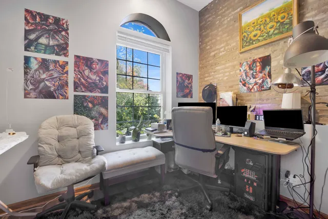 a work room with furniture and a window