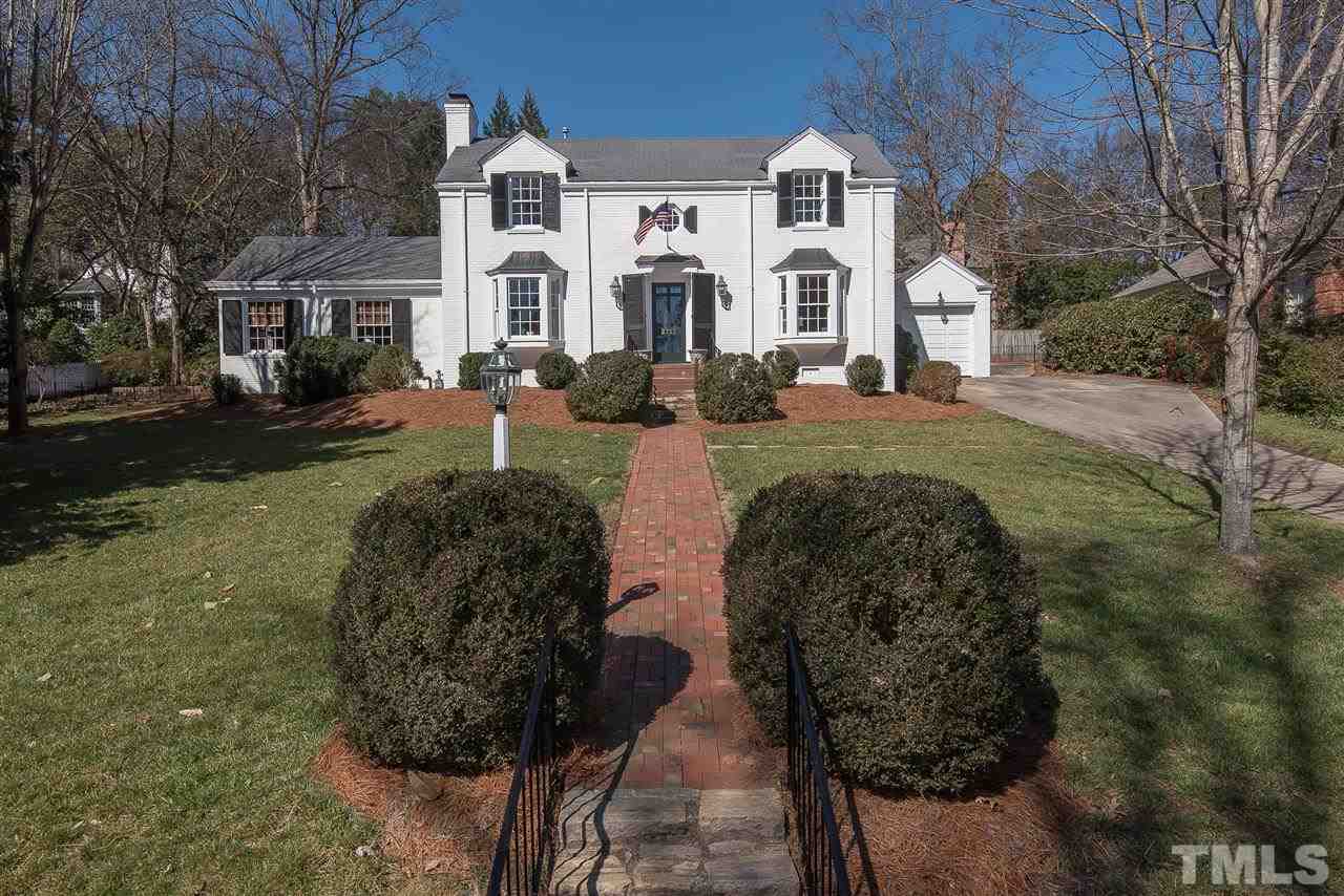 2717 Cambridge Road Raleigh, NC 27608 - Photo 1 of 21 a front view of a house with garden