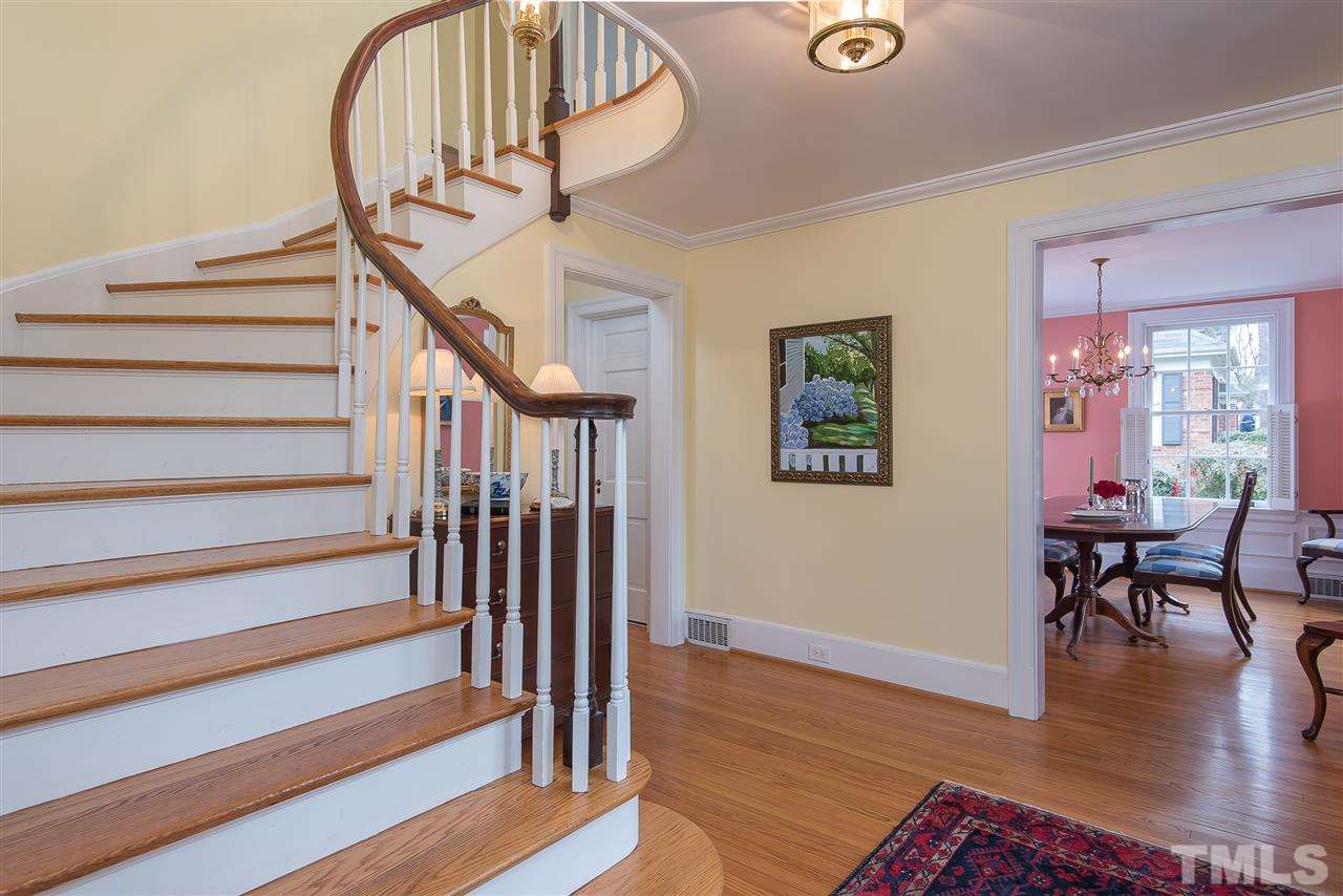 2717 Cambridge Road Raleigh, NC 27608 - Photo 2 of 21 a view of entryway livingroom and hall with wooden floor