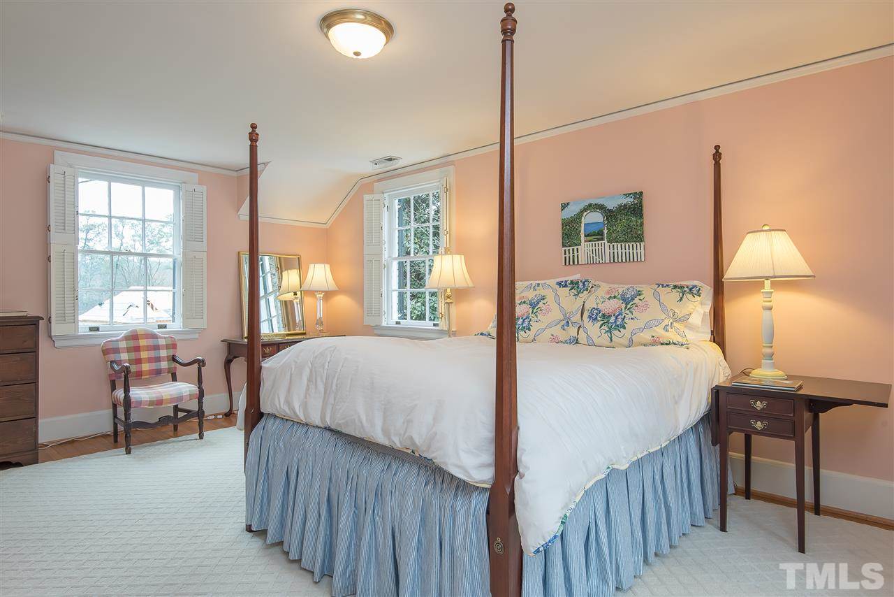 2717 Cambridge Road Raleigh, NC 27608 - Photo 13 of 21 a bedroom with a bed and a table
