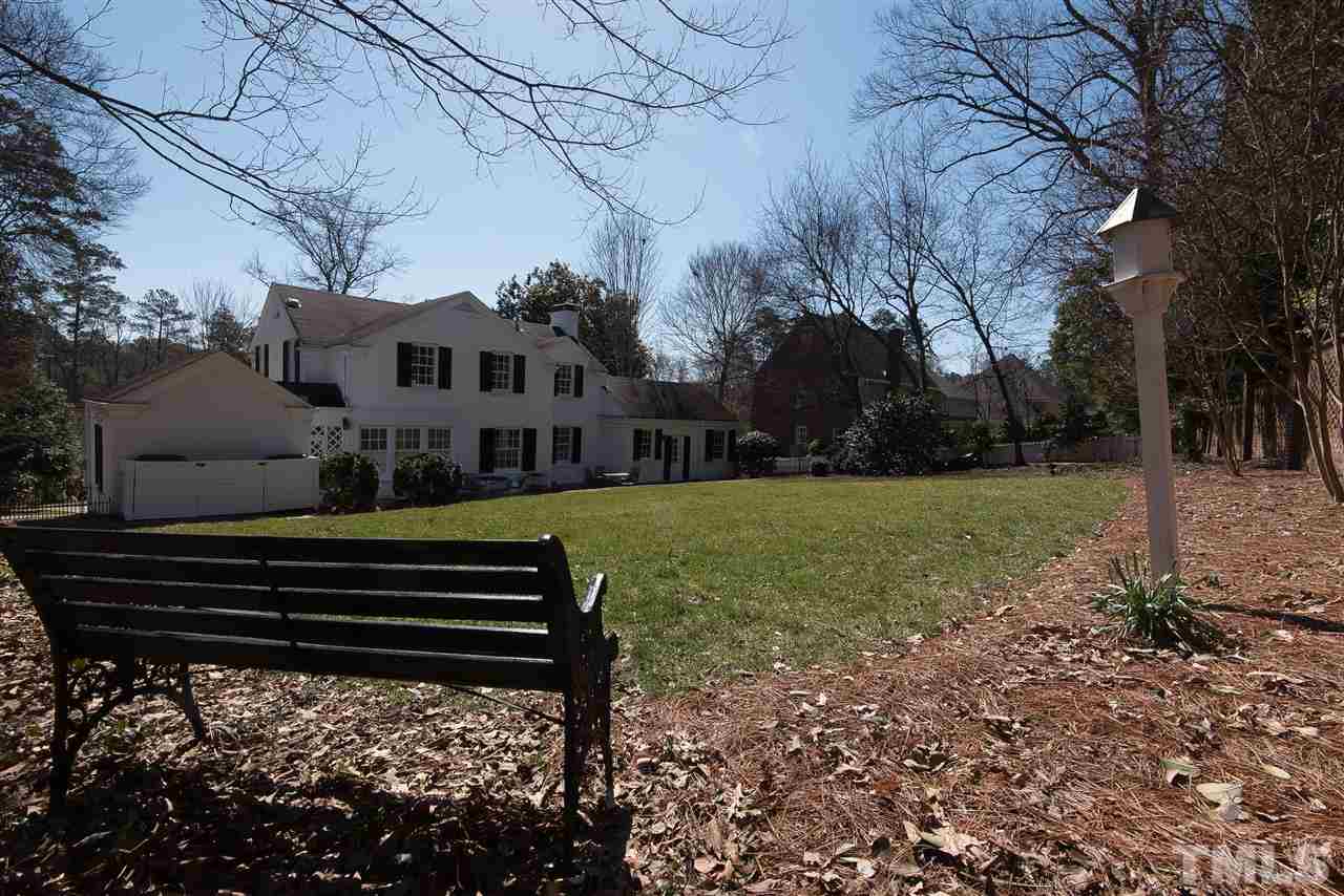 2717 Cambridge Road Raleigh, NC 27608 - Photo 19 of 21 a view of a house with a yard