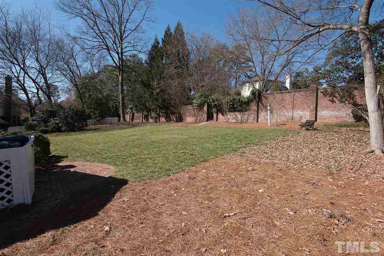 2717 Cambridge Road Raleigh, NC 27608 - Photo 20 of 21 a view of a yard with plants and trees