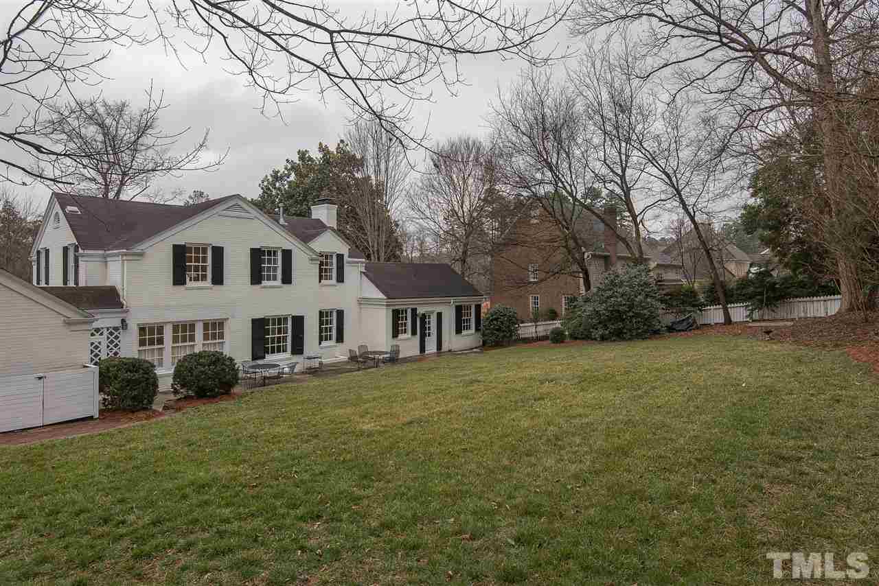 2717 Cambridge Road Raleigh, NC 27608 - Photo 21 of 21 a front view of a house with a garden