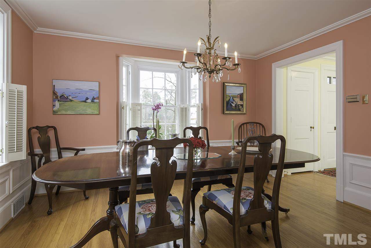 2717 Cambridge Road Raleigh, NC 27608 - Photo 4 of 21 a view of a dining room with furniture window and wooden floor