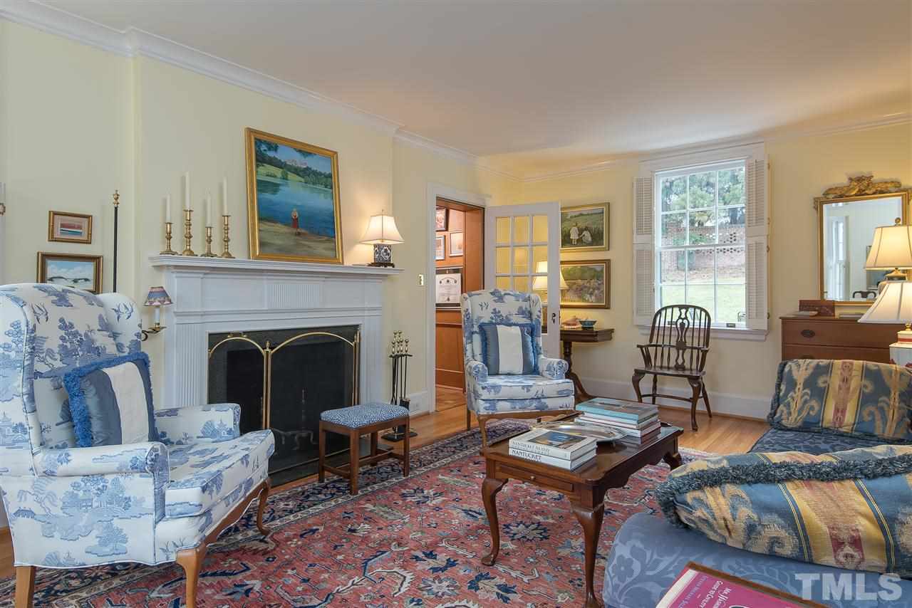 2717 Cambridge Road Raleigh, NC 27608 - Photo 8 of 21 a living room with furniture and a fireplace