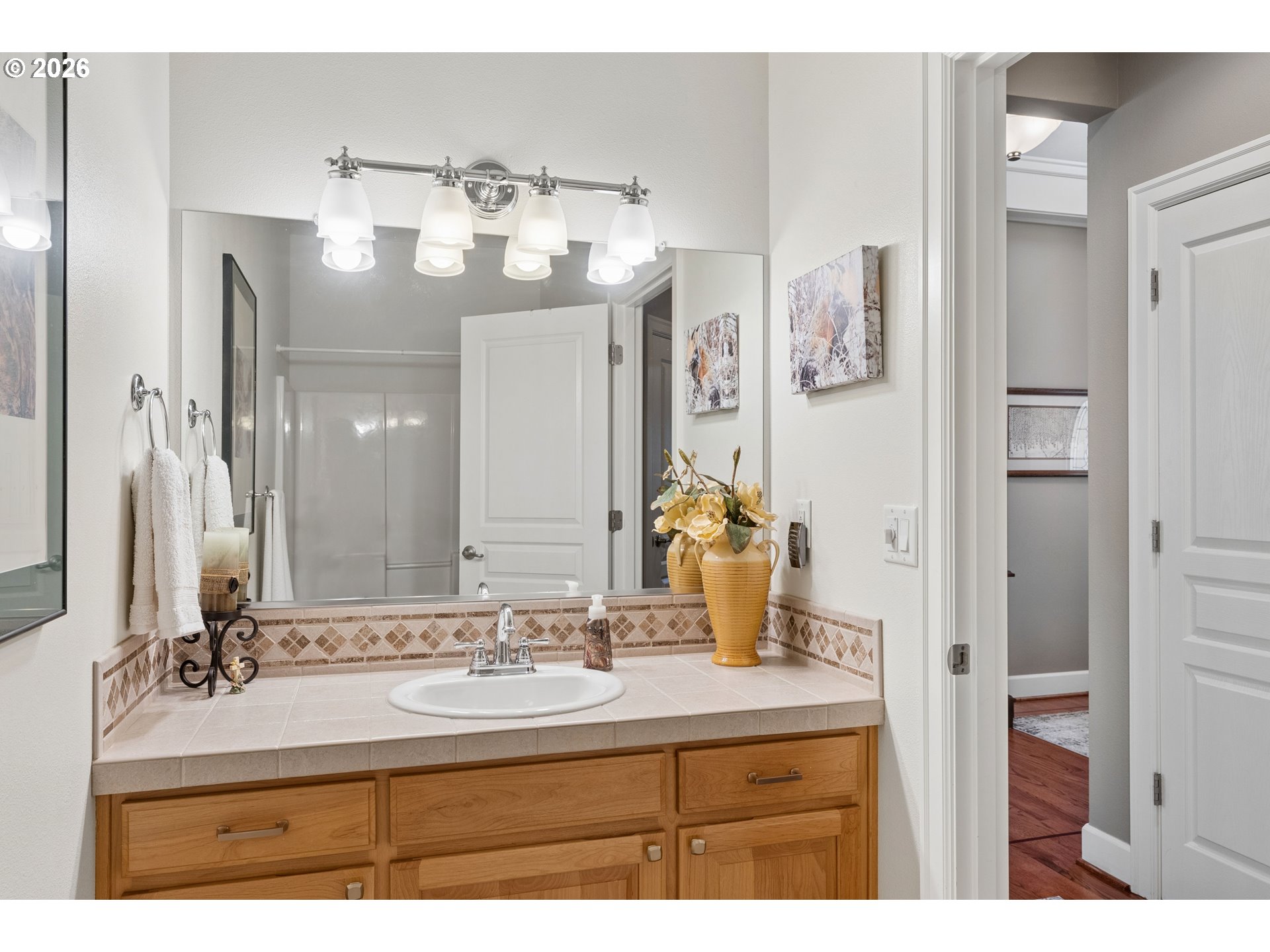945 Northwest Angel Heights Road Stevenson, WA 98648 - Photo 26 of 41 a bathroom with a sink vanity and a mirror