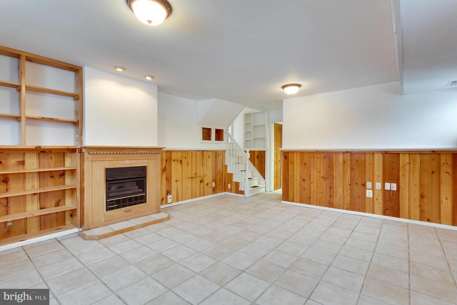 6826 Inverness Drive Springfield, VA 22150 - Photo 16 of 24 Fam room with shelves