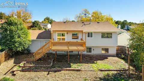 a front view of a house with a yard and seating space