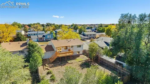 an aerial view of a house with a garden