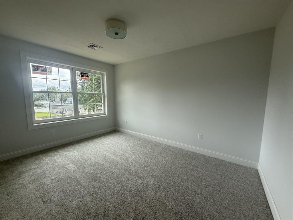 111 Harris Pond Road Blackstone, MA 01504 - Photo 28 of 39 an empty room with windows