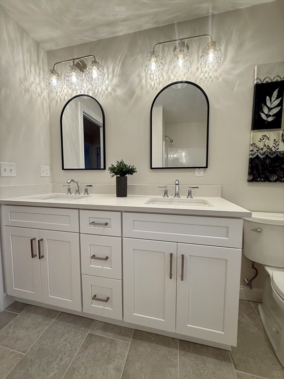 111 Harris Pond Road Blackstone, MA 01504 - Photo 29 of 39 a bathroom with double sink and a mirror