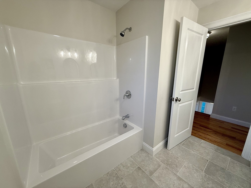 111 Harris Pond Road Blackstone, MA 01504 - Photo 31 of 39 a bathroom with a bathtub and a shower