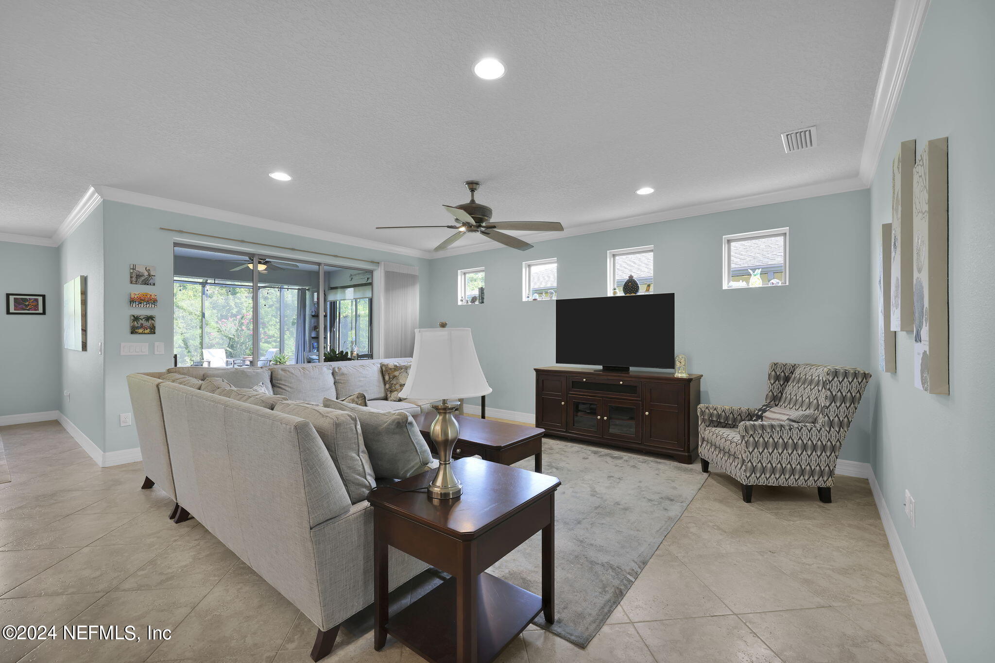 48 Eagle Crest Lane Ponte Vedra, FL 32081 - Photo 16 of 94 a living room with furniture and a flat screen tv