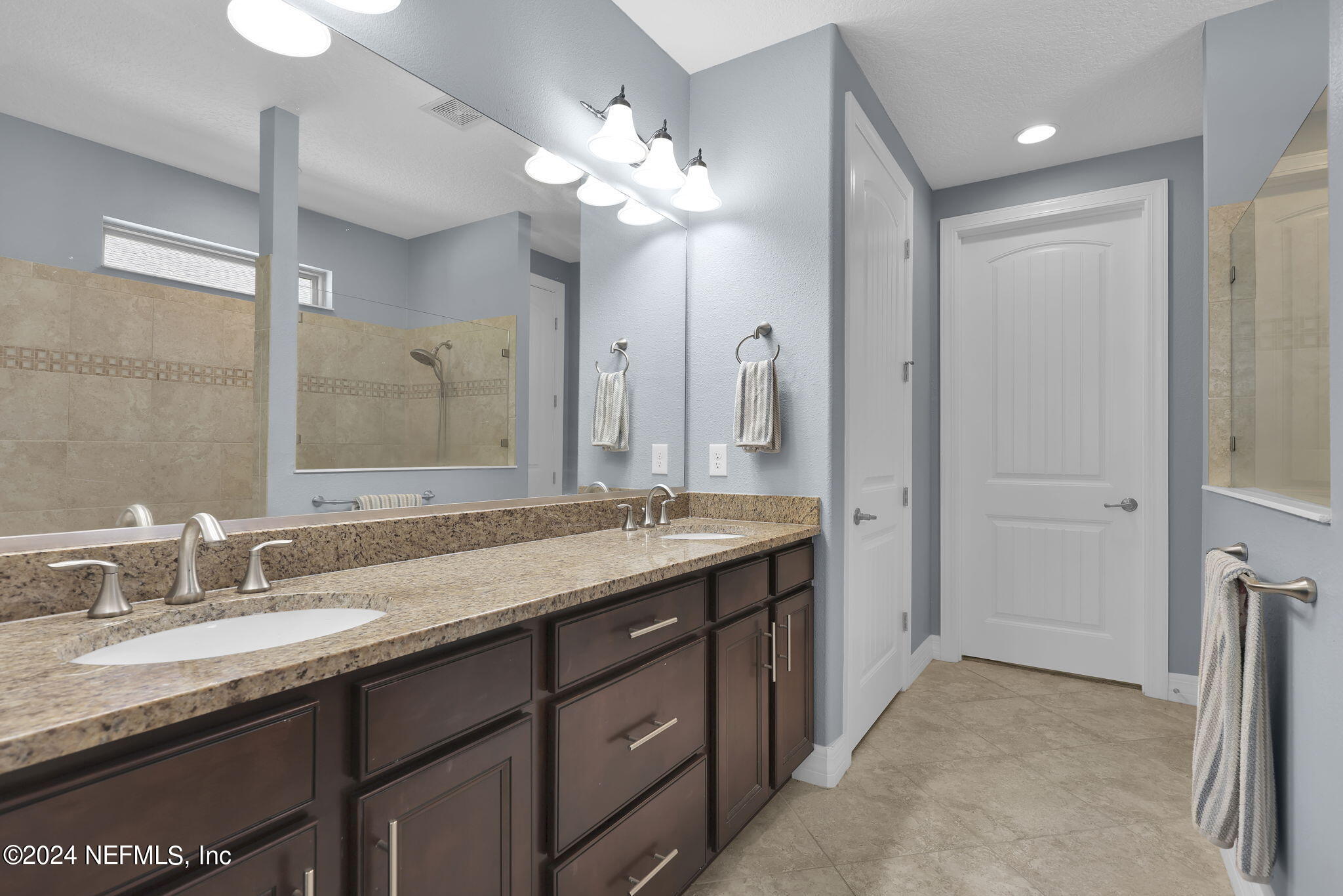 48 Eagle Crest Lane Ponte Vedra, FL 32081 - Photo 19 of 94 a bathroom with a granite countertop double vanity sink a vanity and a large mirror