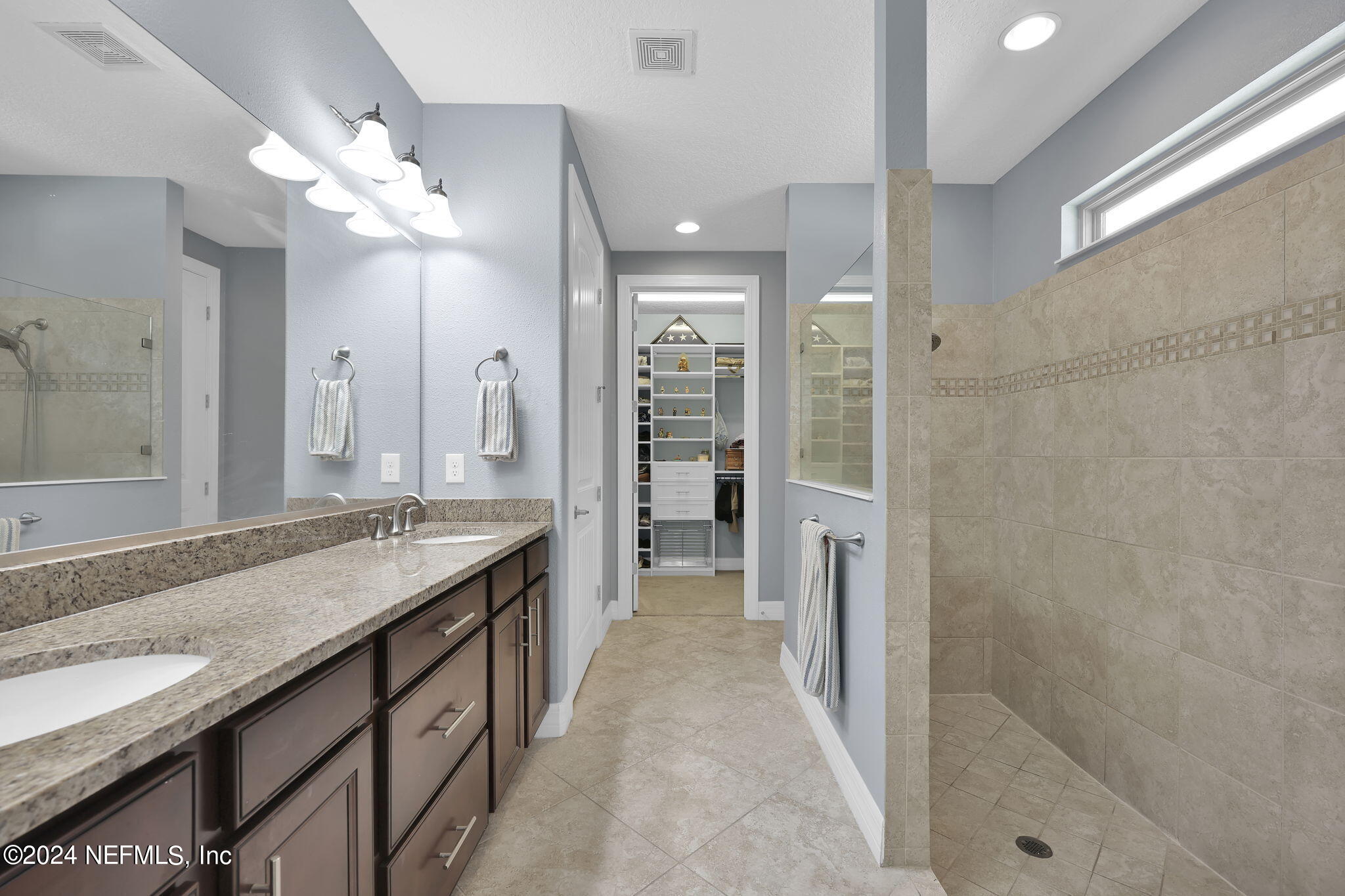 48 Eagle Crest Lane Ponte Vedra, FL 32081 - Photo 20 of 94 a bathroom with a granite countertop sink a shower and a mirror