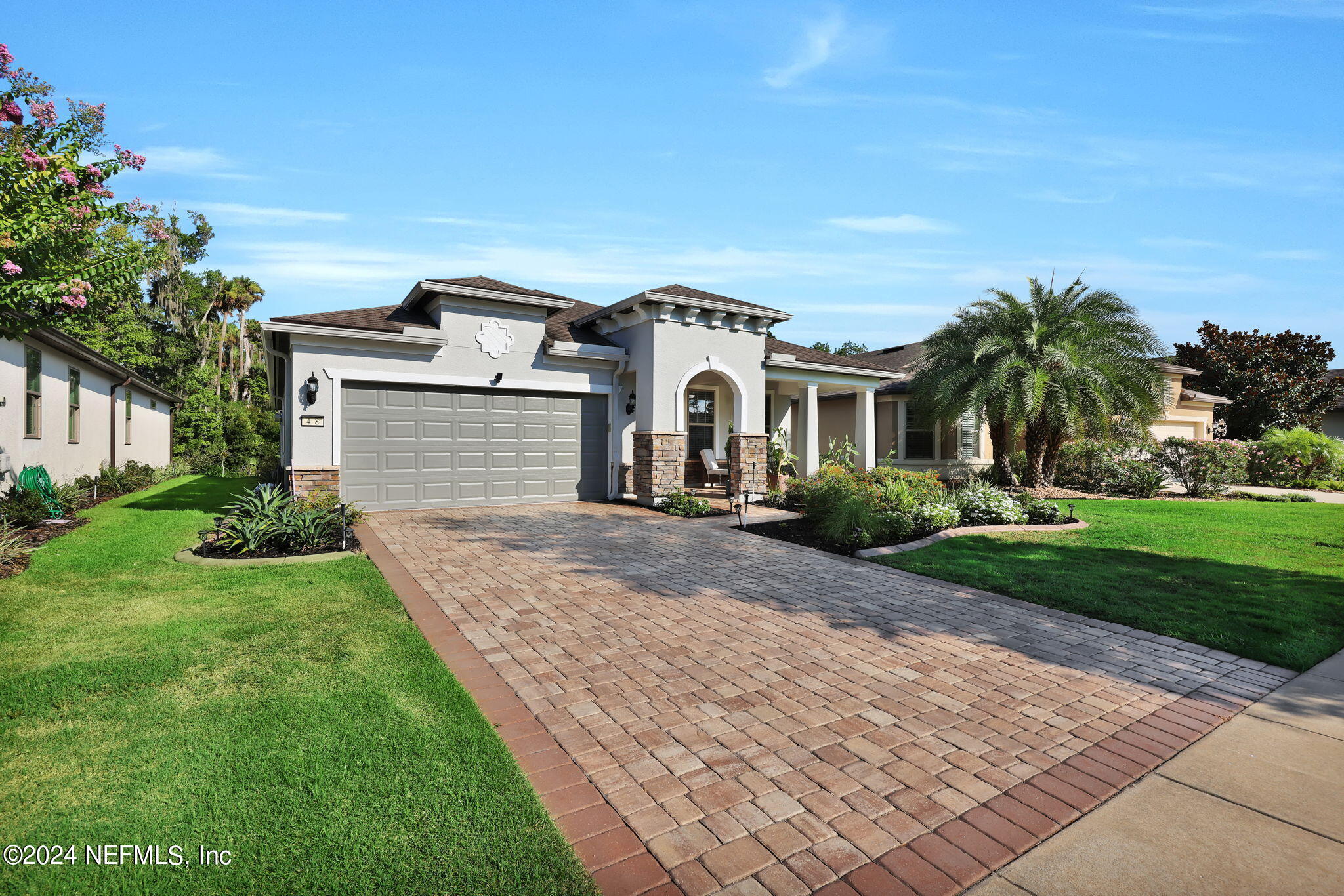 48 Eagle Crest Lane Ponte Vedra, FL 32081 - Photo 3 of 94 a front view of a house with a yard and garage