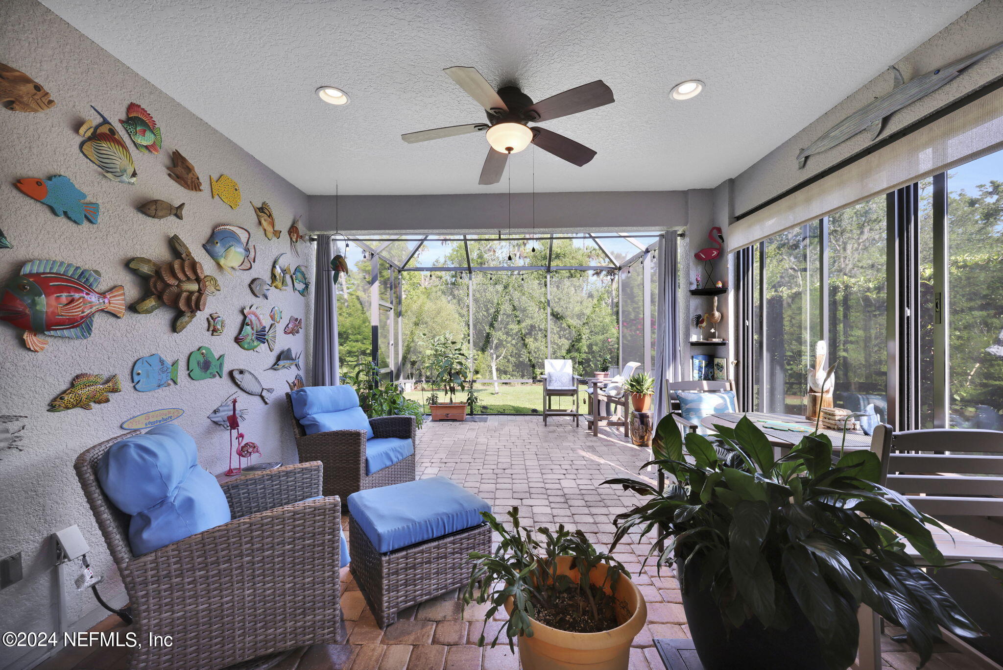 48 Eagle Crest Lane Ponte Vedra, FL 32081 - Photo 31 of 94 a living room with furniture and a large window with potted plants