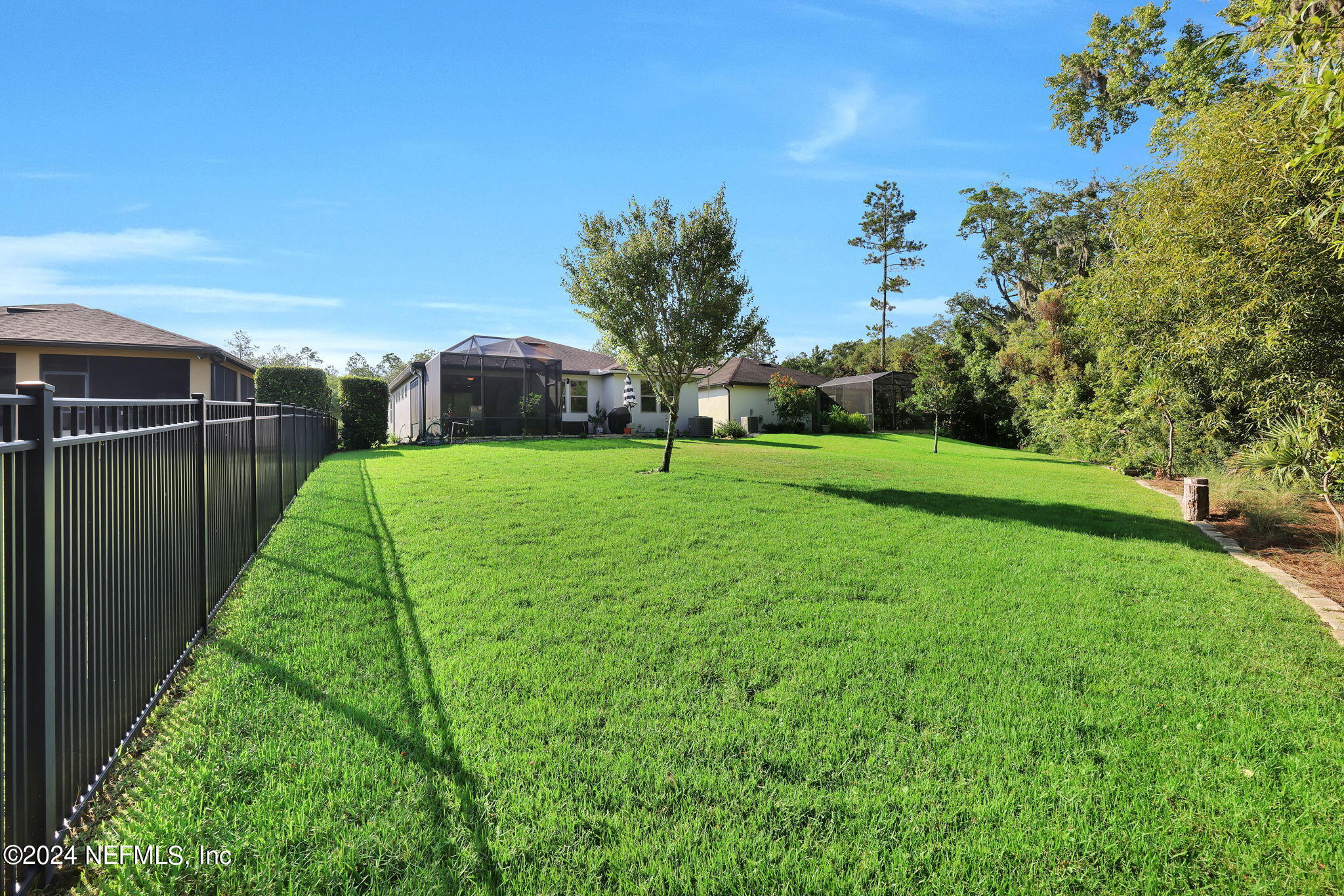48 Eagle Crest Lane Ponte Vedra, FL 32081 - Photo 37 of 94 a view of a garden with a building in the background