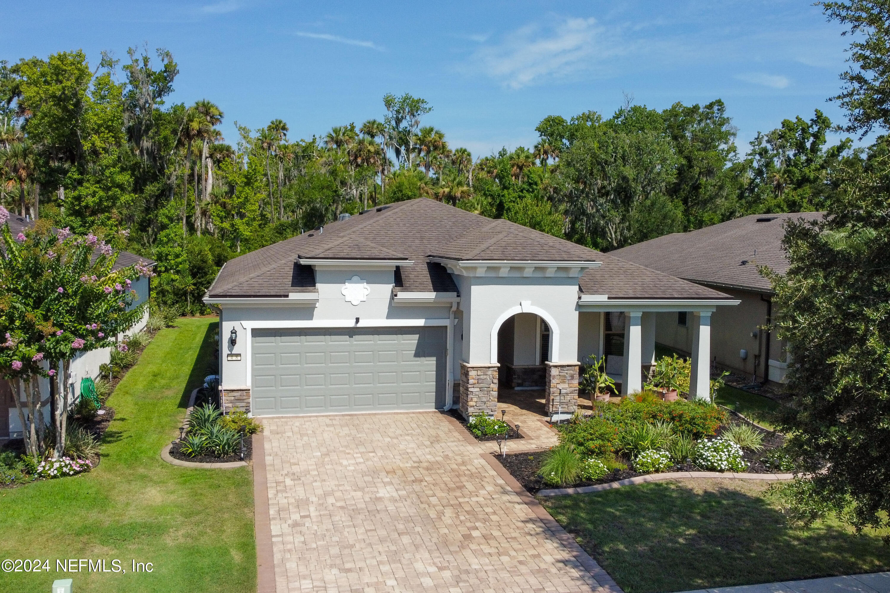 48 Eagle Crest Lane Ponte Vedra, FL 32081 - Photo 41 of 94 a front view of a house with garden