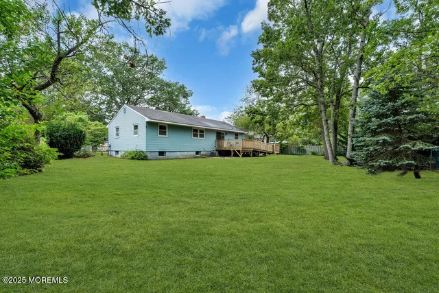 a front view of house with a garden