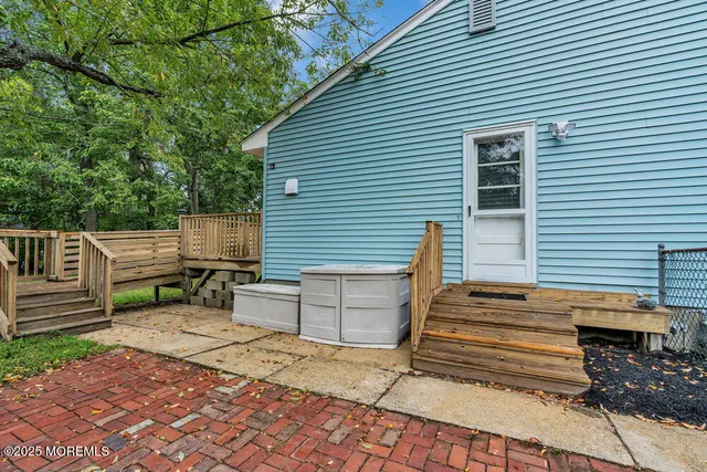a view of a patio with a table and chairs