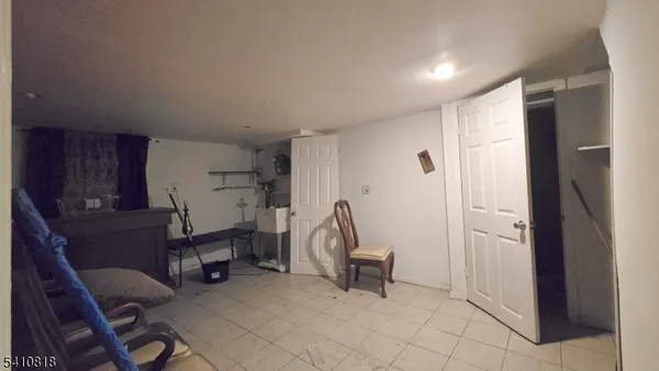 a view of kitchen with furniture and wooden cabinets