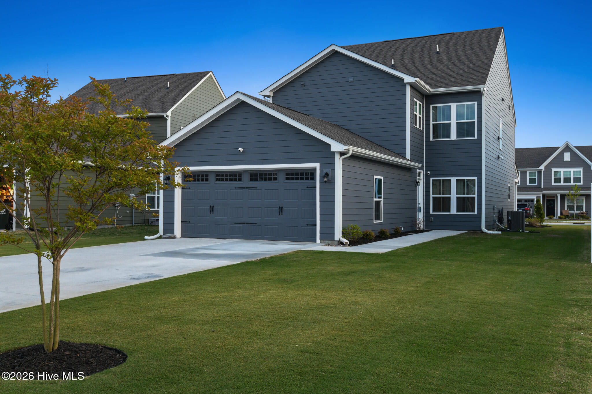 406 Ryker Road East Moyock, NC 27958 - Photo 2 of 35 Convenient garage and driveway parking with additional street parking in front.