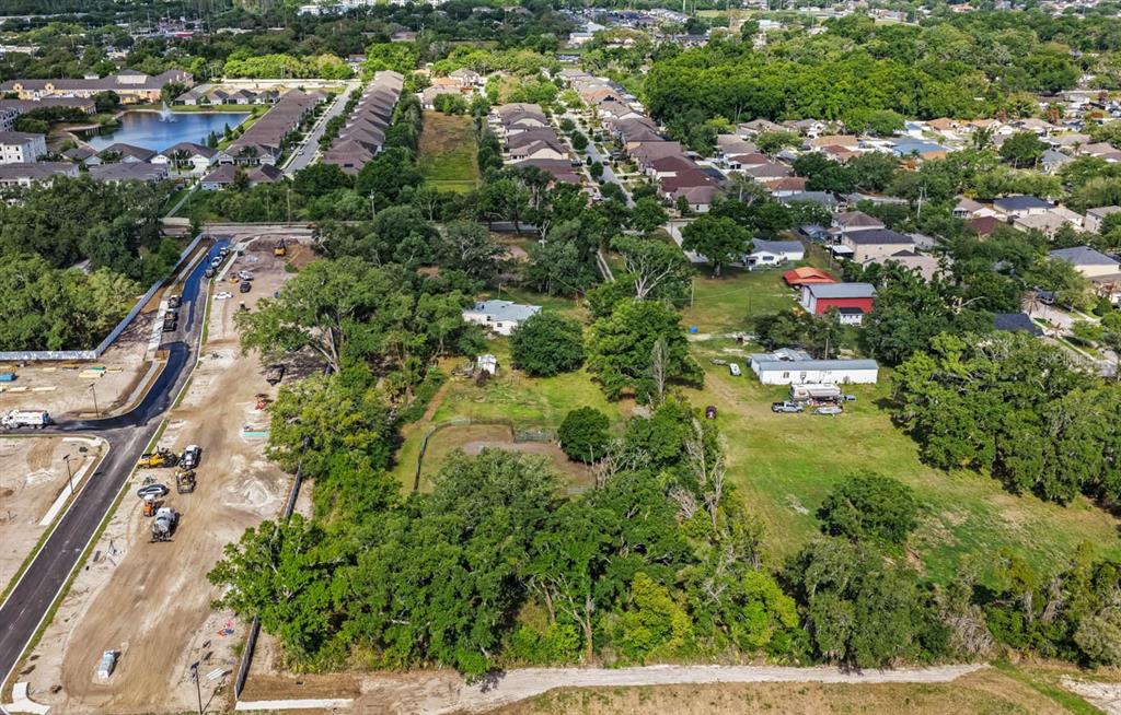 5614 Watson Road Riverview, FL 33578 - Photo 16 of 16 an aerial view of residential house with outdoor space and trees all around