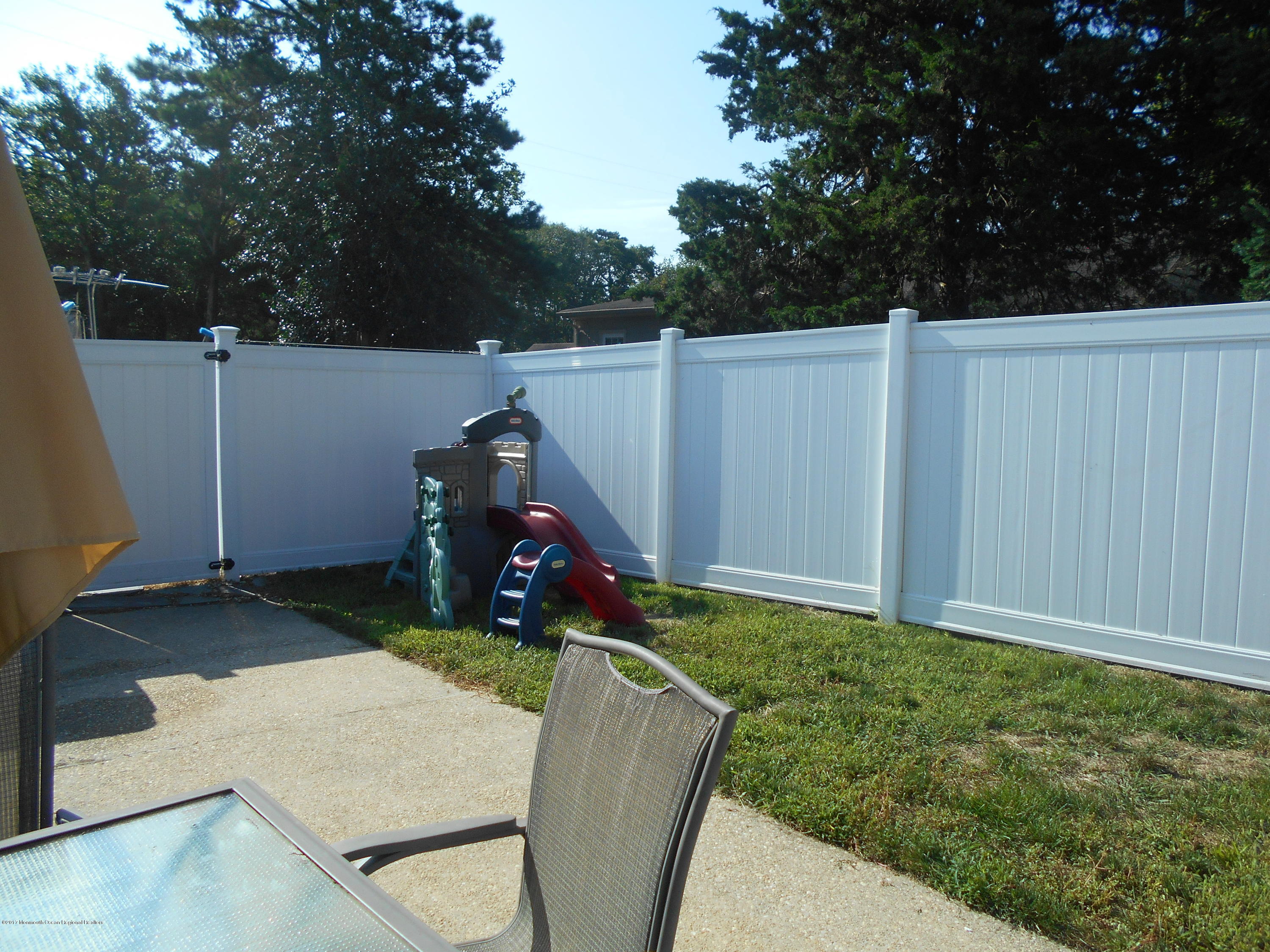 28 Hulse Landing Road Brick, NJ 08723 - Photo 13 of 19 a backyard of a house with seating space and trees