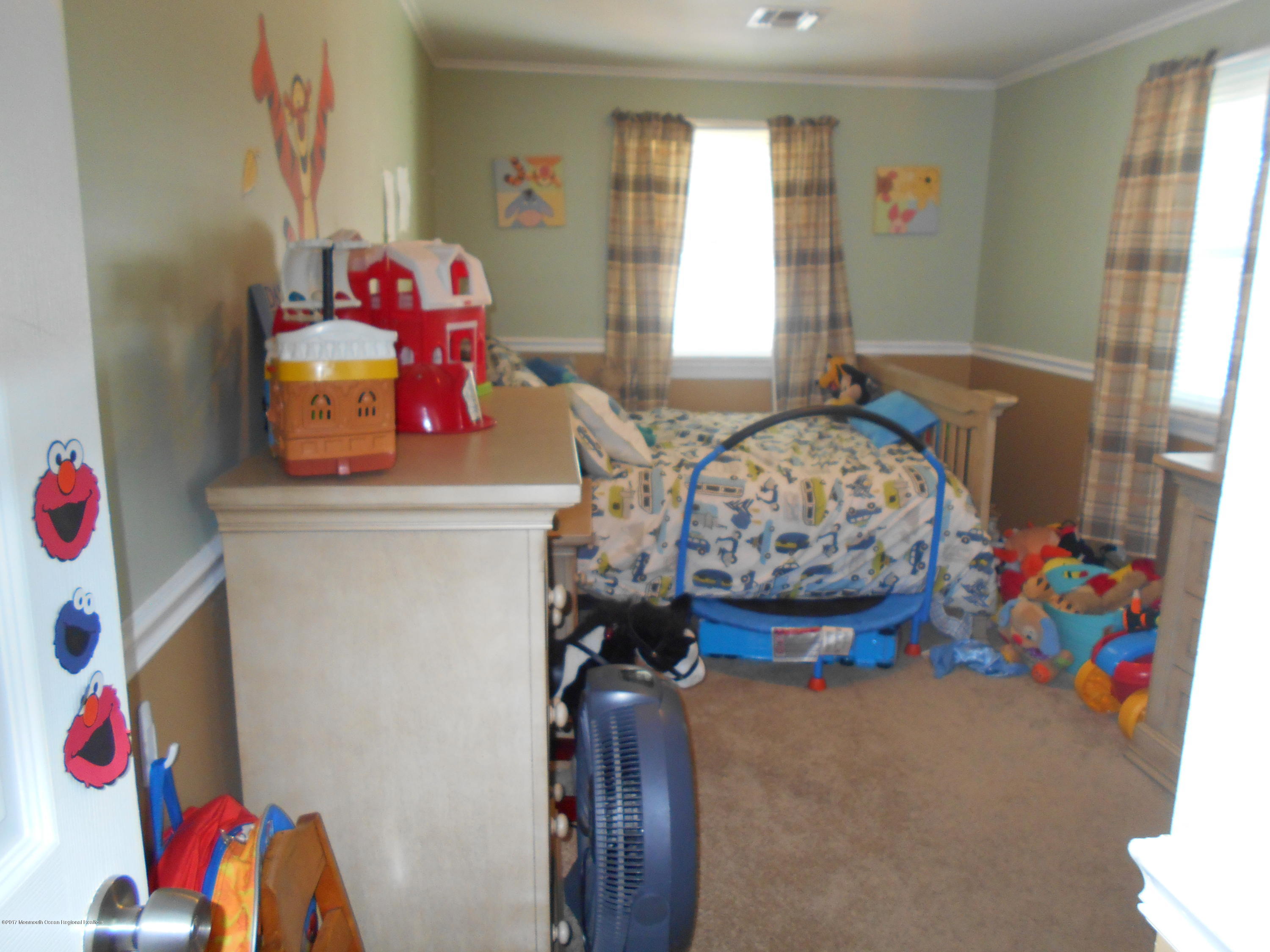28 Hulse Landing Road Brick, NJ 08723 - Photo 8 of 19 a bedroom with a bed and a window