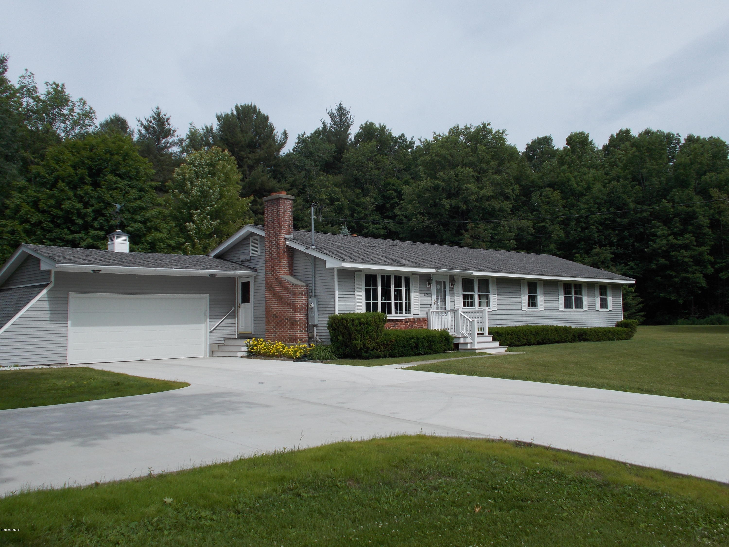 477 South Washington State Road Washington, MA 01223 - Photo 1 of 36 a front view of a house with a yard and trees