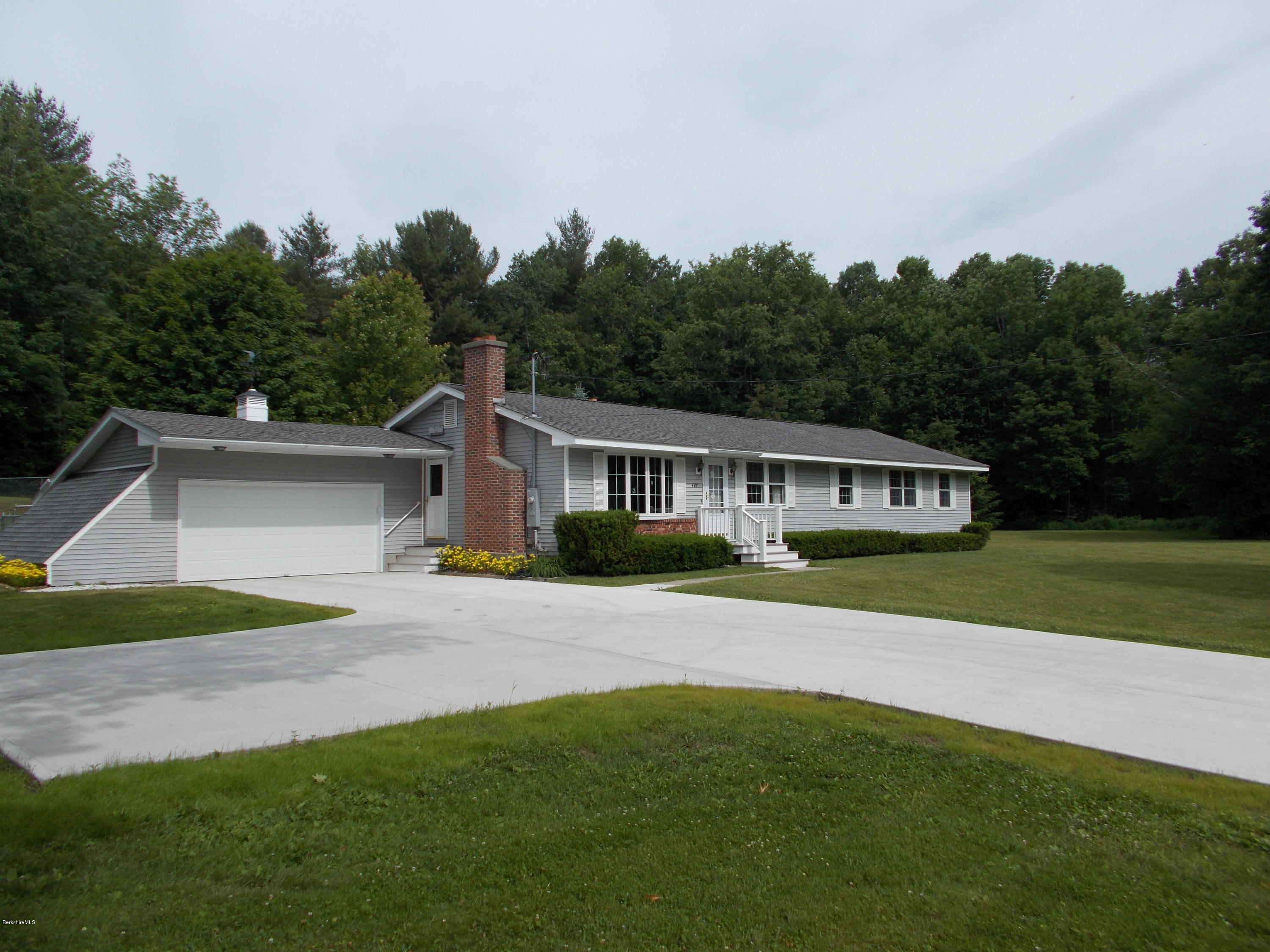 477 South Washington State Road Washington, MA 01223 - Photo 3 of 36 a front view of a house with a yard and trees
