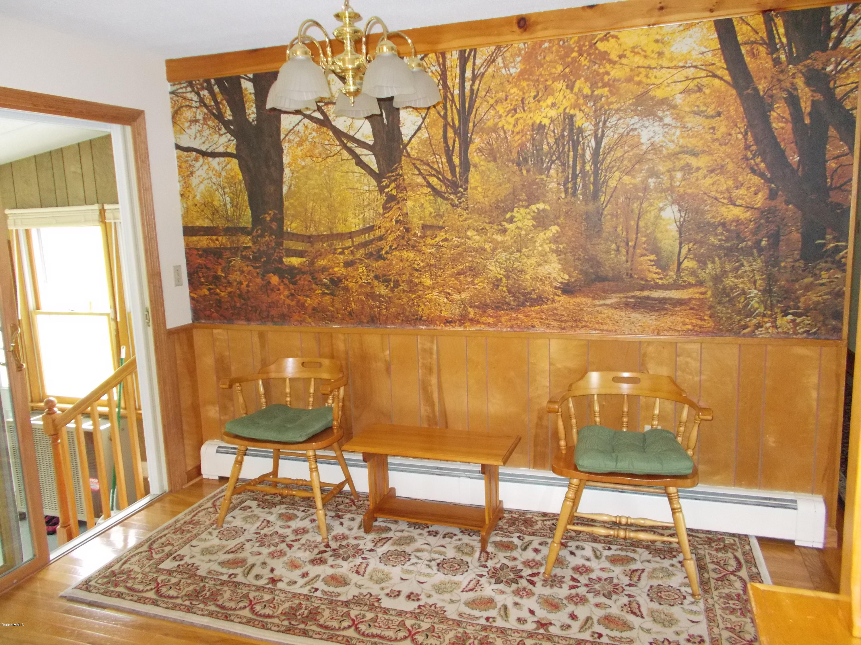 477 South Washington State Road Washington, MA 01223 - Photo 8 of 36 a living room with a rug and a table