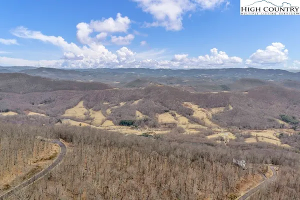 a view of a dry yard with mountain