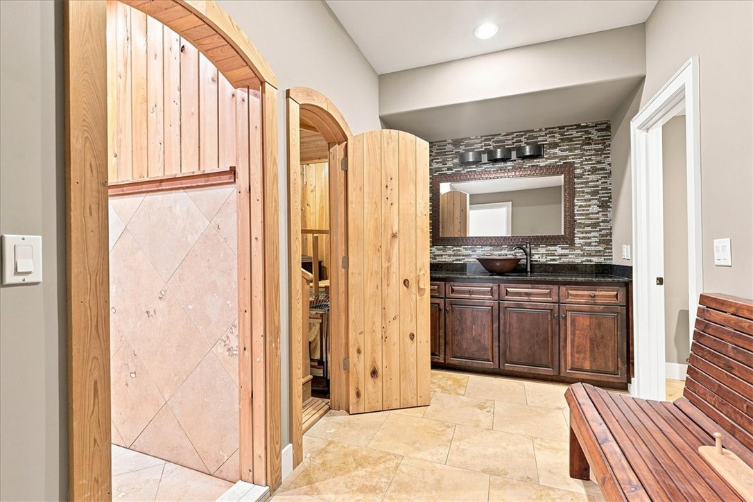 181 Sentell Road Williamston, SC 29697 - Photo 38 of 46 Lower level full bathroom with sauna and huge shower. Rich wood trim and travertine floor highlight this spa-like bathroom retreat.