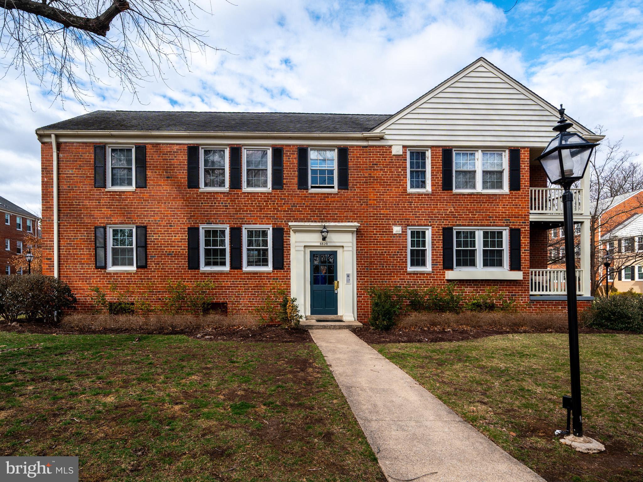 6620 Boulevard View, Unit A1 Alexandria, VA 22307 - Photo 1 of 25 a front view of a house with garden