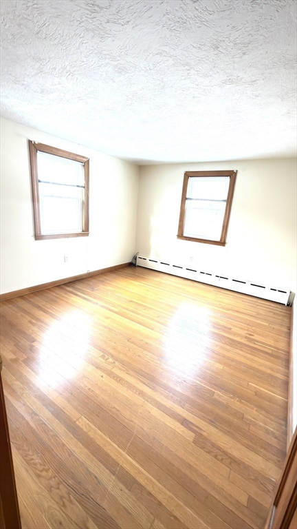 930 Sea Street Quincy, MA 02169 - Photo 19 of 29 a view of a room with wooden floor
