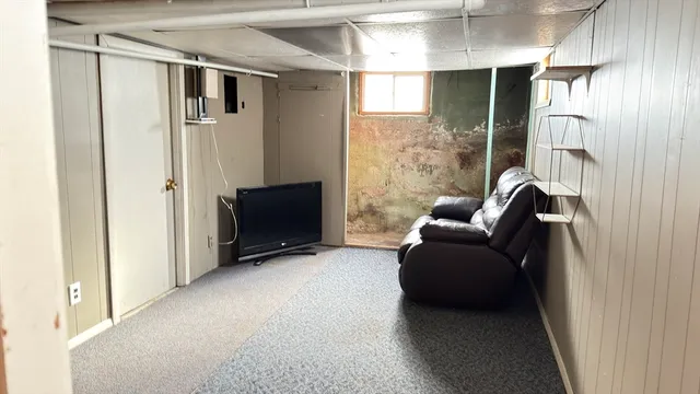 a view of an empty room with a fireplace