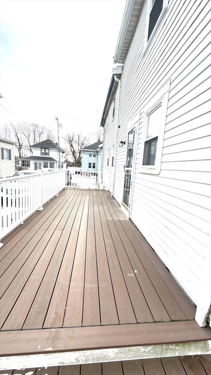 930 Sea Street Quincy, MA 02169 - Photo 9 of 29 a view of a terrace with wooden floor