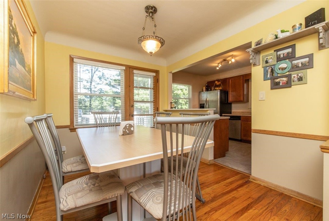 1100 Haverston Road Lyndhurst, OH 44124 - Photo 5 of 24 Dining Room with Hardwood Floors and Door Leading to
the Deck
