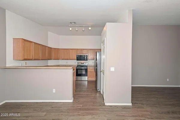 a view of kitchen and wooden floor