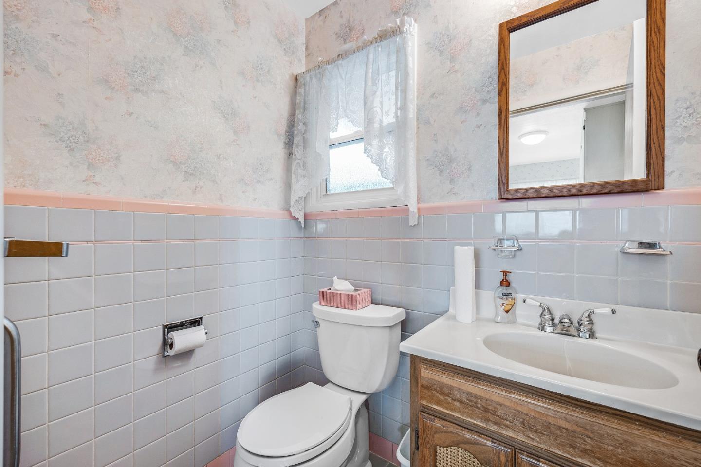 6 Fairview Place Millbrae, CA 94030 - Photo 14 of 19 a bathroom with a sink a toilet and a mirror