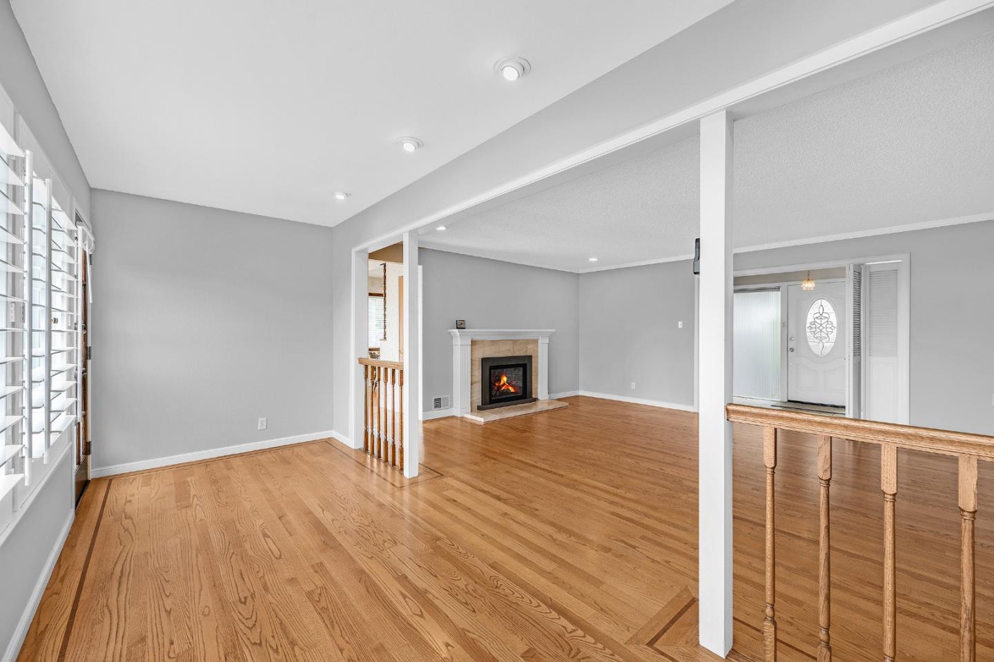 6 Fairview Place Millbrae, CA 94030 - Photo 3 of 19 a view of empty room with wooden floor and fireplace