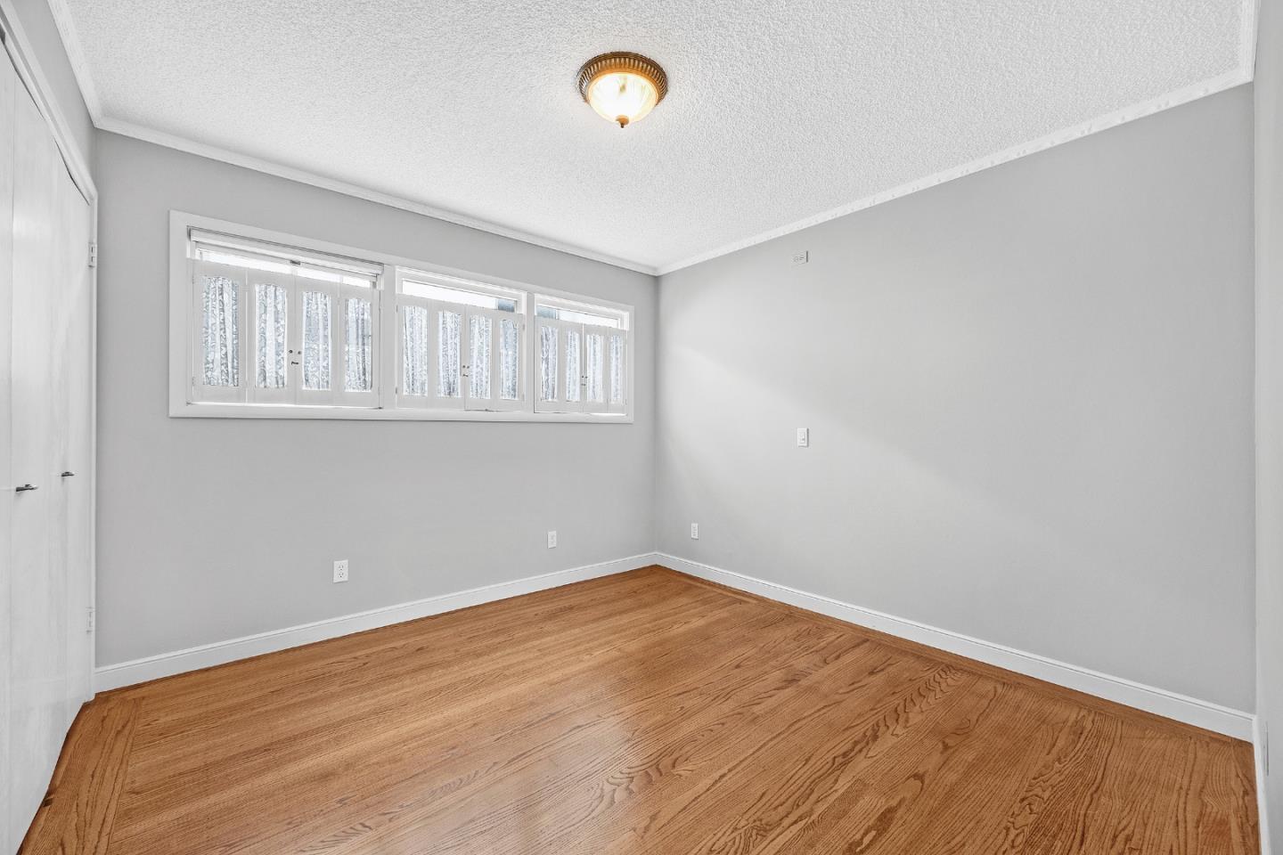 6 Fairview Place Millbrae, CA 94030 - Photo 4 of 19 a view of empty room with wooden floor