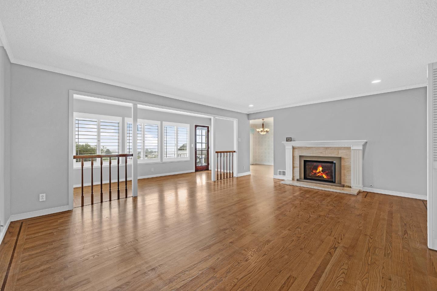 6 Fairview Place Millbrae, CA 94030 - Photo 7 of 19 a view of an empty room with wooden floor and a window